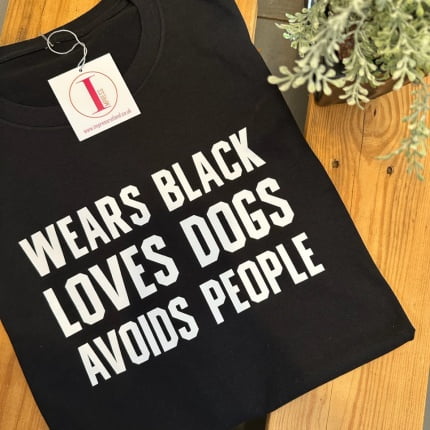 'WEARS BLACK LOVES DOGS AVOIDS PEOPLE'